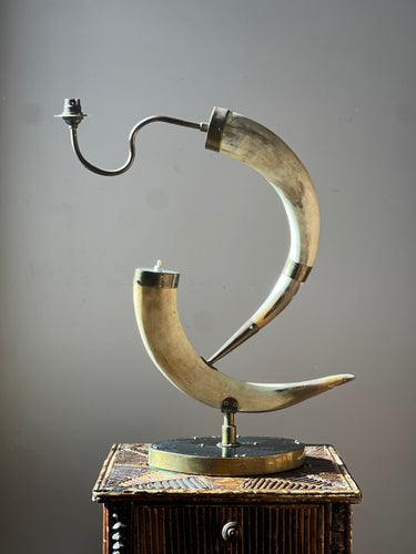 Circa 1950 hand crafted lamp made from brass mounted cow horns.