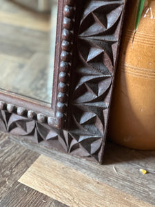 Hand carved arts and crafts mirror