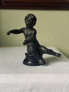 Circa 19th century bronze putti on ebonised base