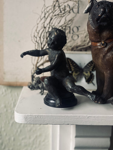 Circa 19th century bronze putti on ebonised base